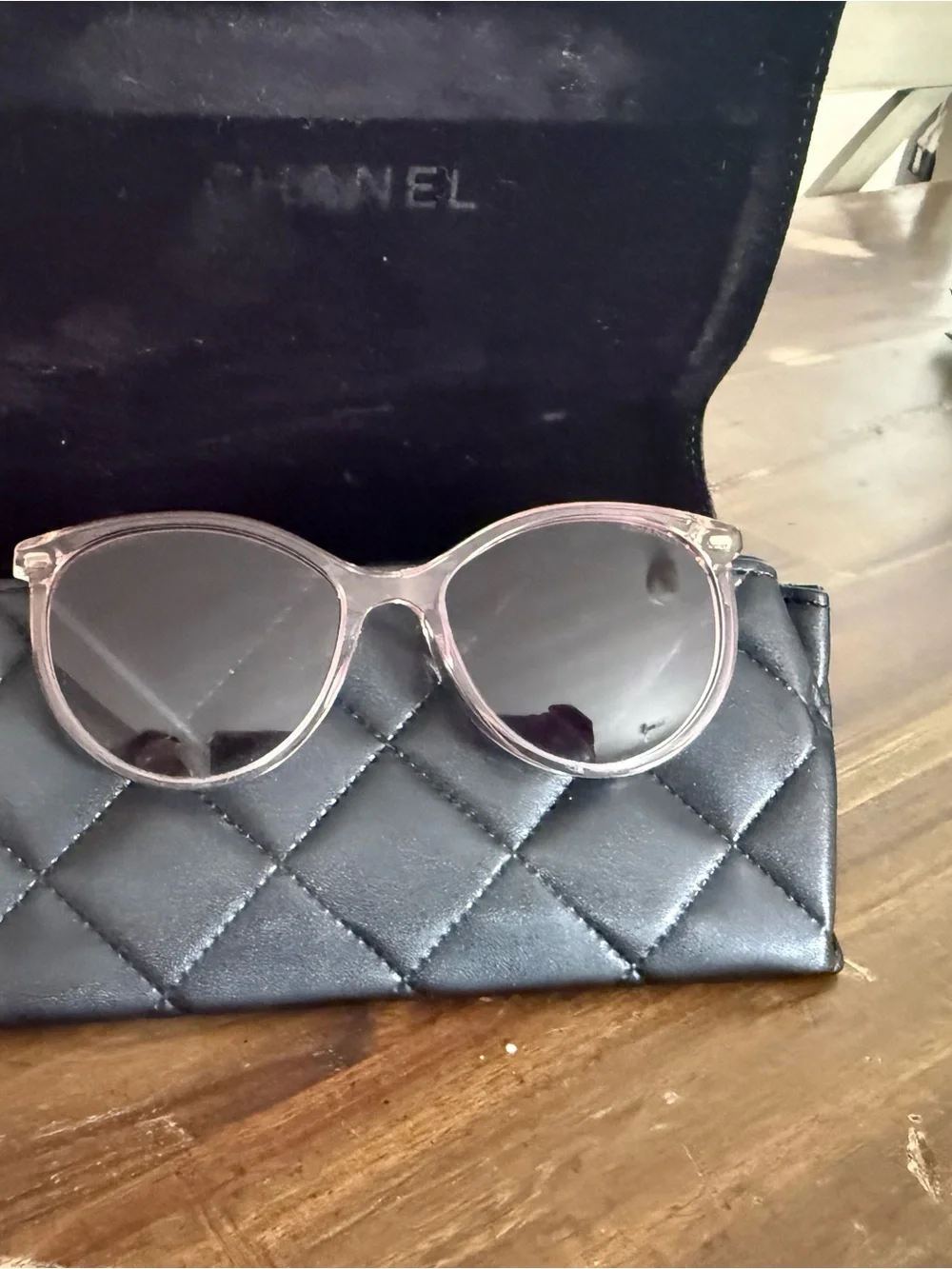 CHANEL Transparent Light Pink Round Sunglasses with Dark Lenses